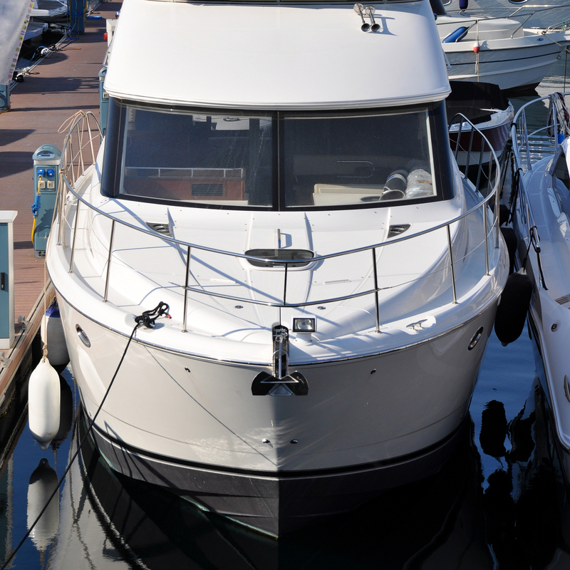 Boat with windshield sitting in the harbor